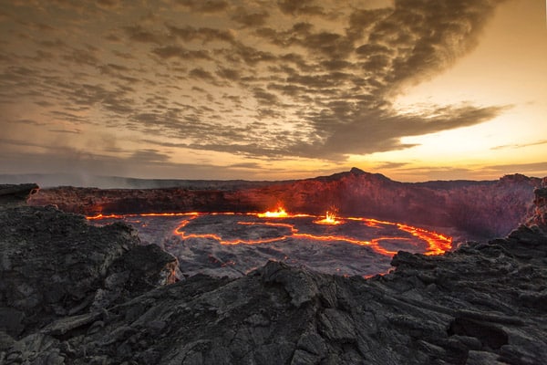 Molten lava glows inside the crater of Erta Ale volcano in Ethiopia&rsquo;s remote Danakil Depression, showcasing the raw, untamed beauty of one of Africa&rsquo;s most intrepid landscapes.