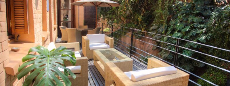 Maison Gallieni Madagascar Luxury Safari Villa. Outside seating area immersed in vegetation.