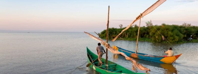 Entebbe Uganda Lake Victoria, Two row boats going over smooth waters. Luxury African Safari.