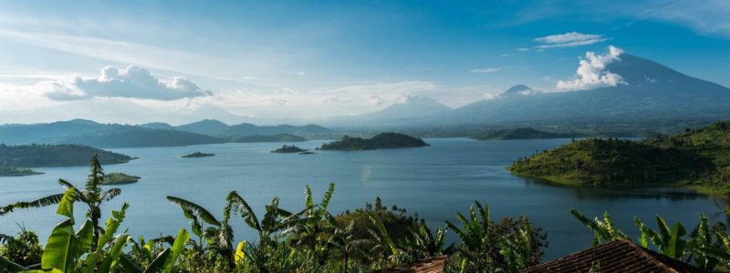 Rwanda Lake Ruhondo high up view of green scenery and clear blue ocean and skies. African safari.