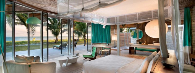 Time + Tide Miavana Villa luxury interior bedding, bedroom, furniture, Ocean and beach view from interior and decking area.