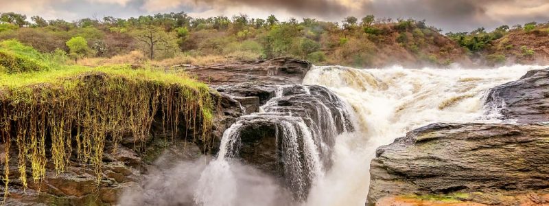 Beautiful running river waterfall surrounded by picturesque scenery. Luxury African safari.