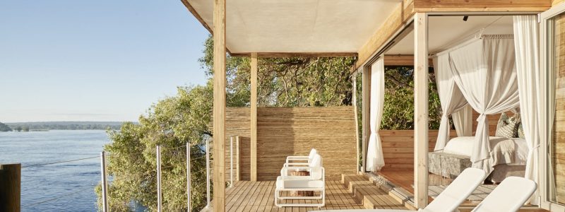 Victoria Falls Island Lodge. Decking area overlooking Zimbabwe river and African skies.