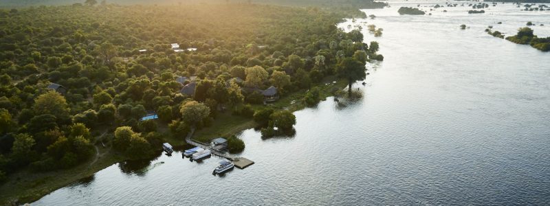 Aerial view of Zambezi Crescent, Victoria Falls River Lodge's river and green landscape. On Zimbabwe African safari.