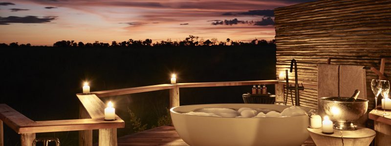 View of Botswana landscape from bath and decking area of Sanctuary Retreats luxury hotel.