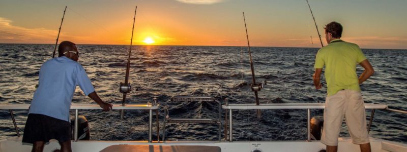 Tsarabanjina Madagascar finishing on back of boat into deep blue African seas. Luxury African safari.