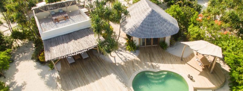 Ariel view of best luxury African villas, pool and decking area. African style exteriors and vegetation.