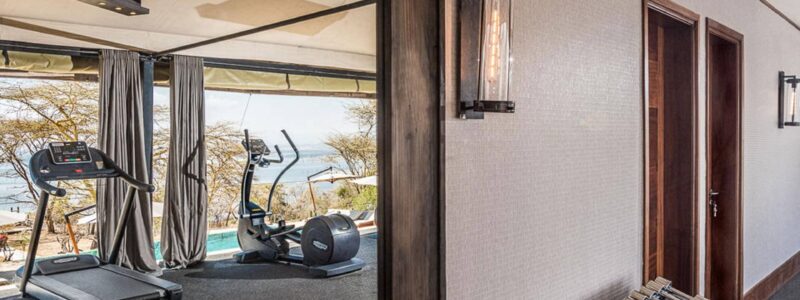 Luxury Kenya Safari The Cliff Gym overlooking pool area and African coastline.