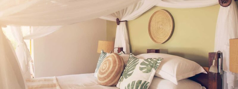 Close up of Azura Benguerra Beach Villa: bedding, bed, African Luxury villa design, interior.