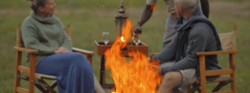 Asilia-Ol-Pejeta-Bush-Camp-Guests-enjoying-drinks-around-the-camp-fire-