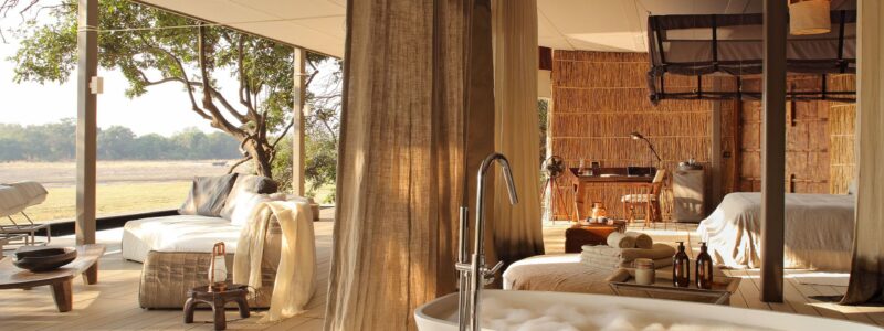 Bedroom-leading-out-onto-a-private-deck-and-plunge-pool-at-Time-+-Tide-Chinzombo