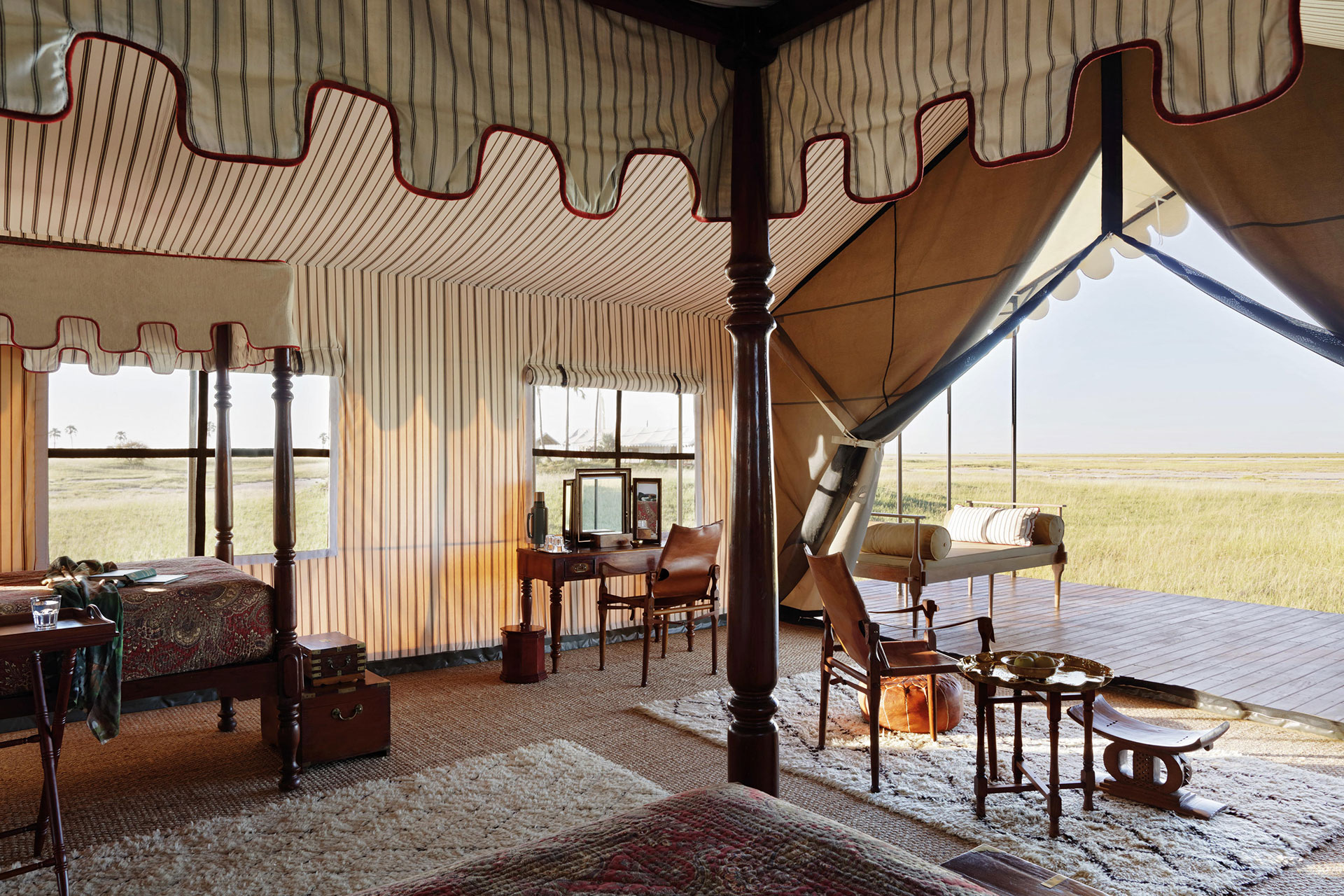 The interior of a luxury canvas tent with furniture