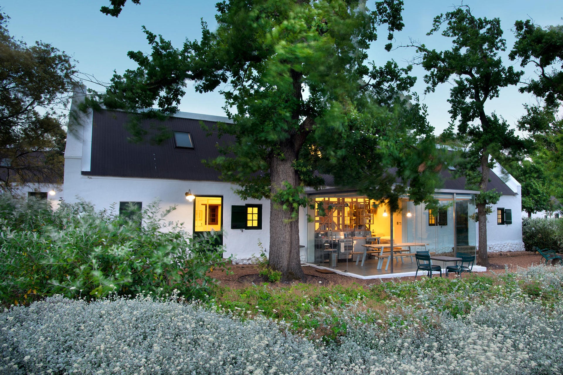 A cottage and trees at Babylonstoren Farm and Hotel 