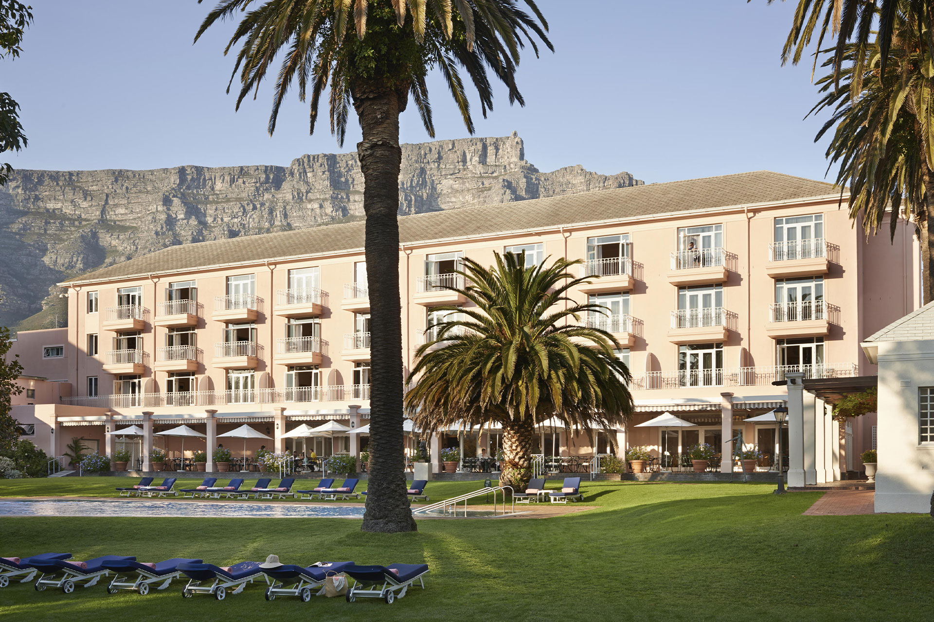 The swimming pool and lawns at the Belmond Mount Nelson