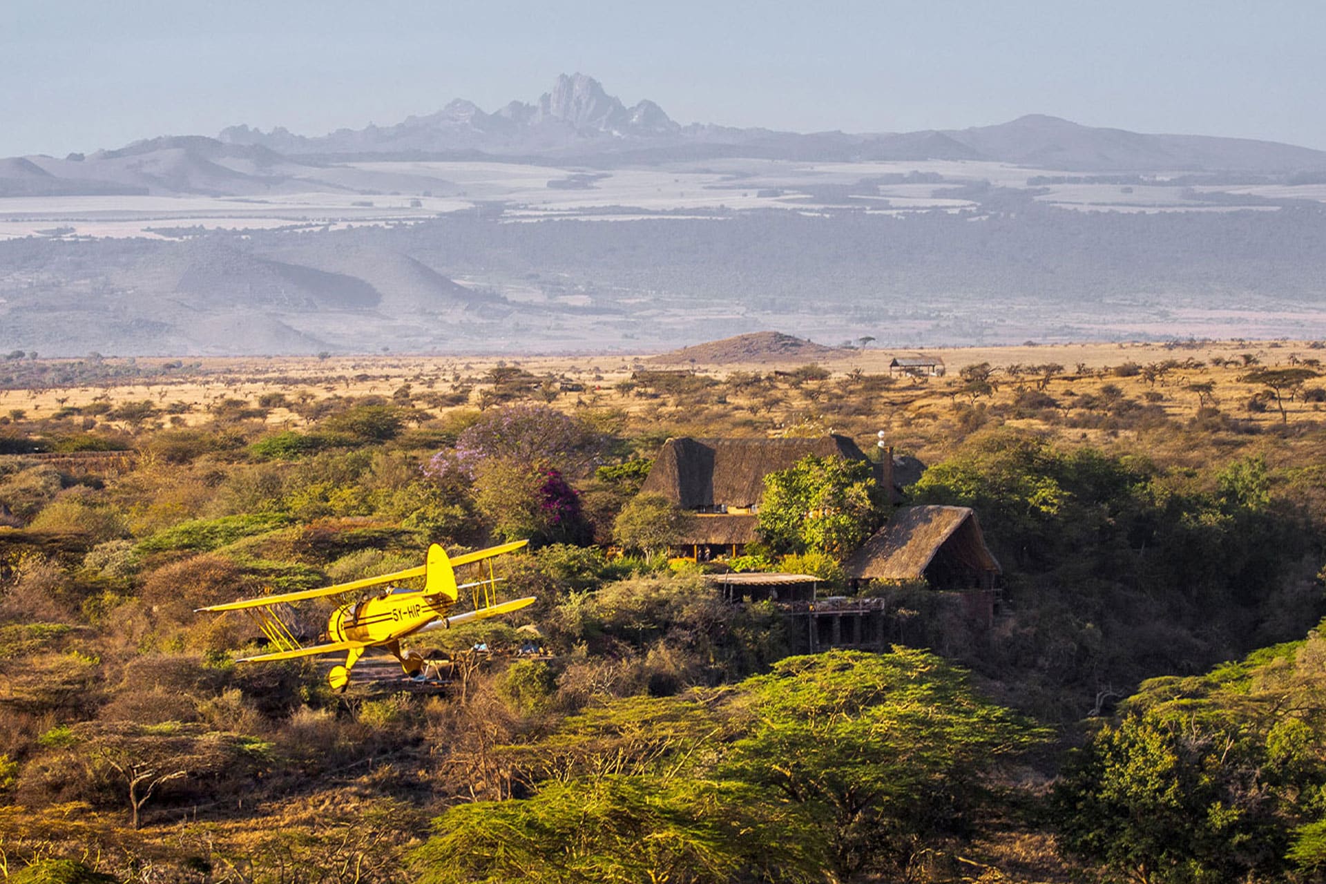 A bush lodge and airplane 