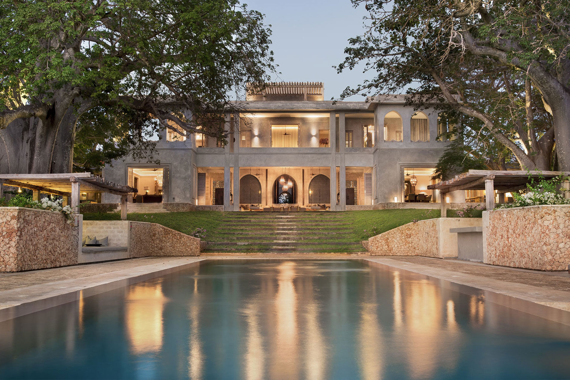 The pool and front facade at Cardamom House, a luxury lodge in East Africa.
