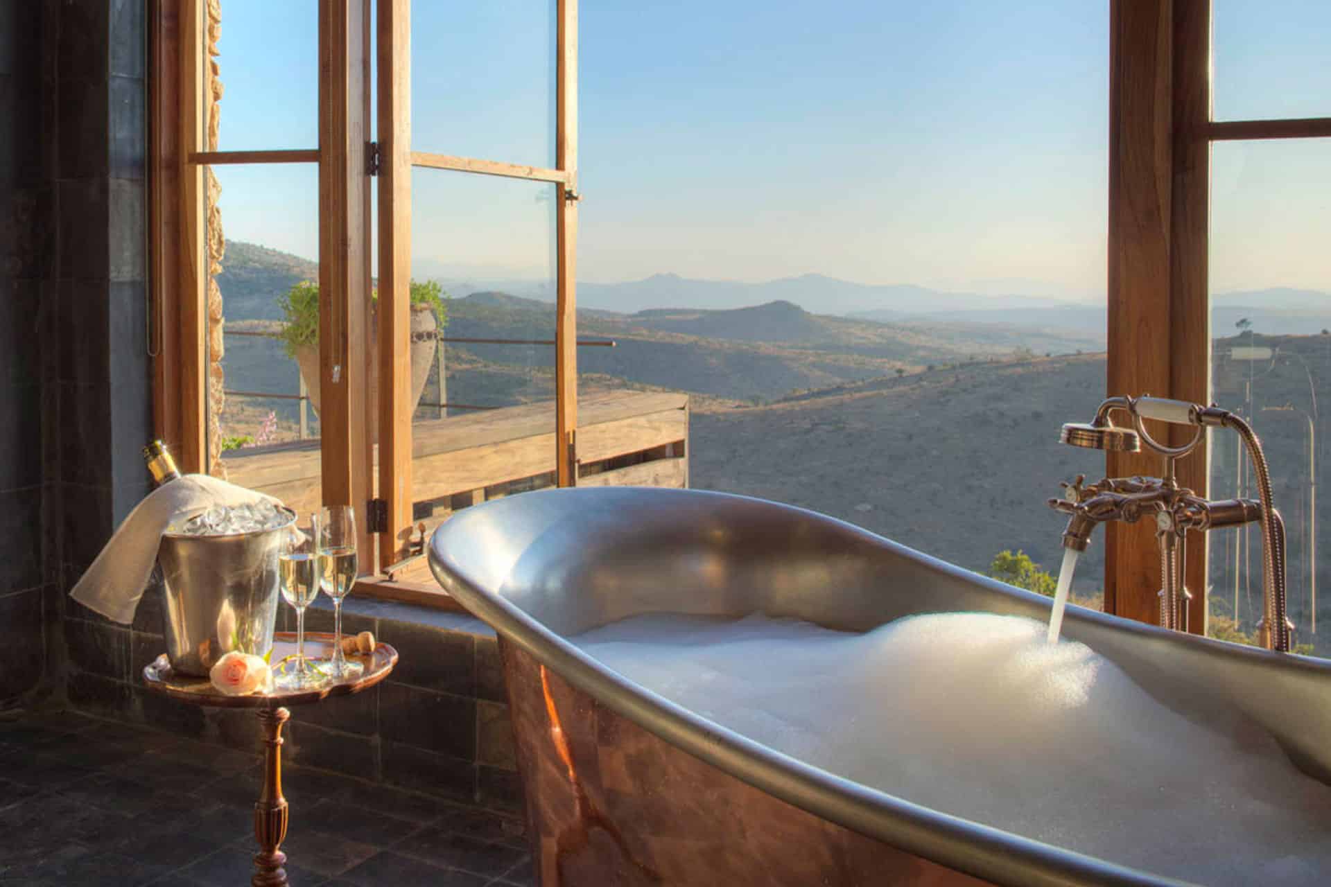 A bedroom at Lengishu House with fireplace and scenic views. 