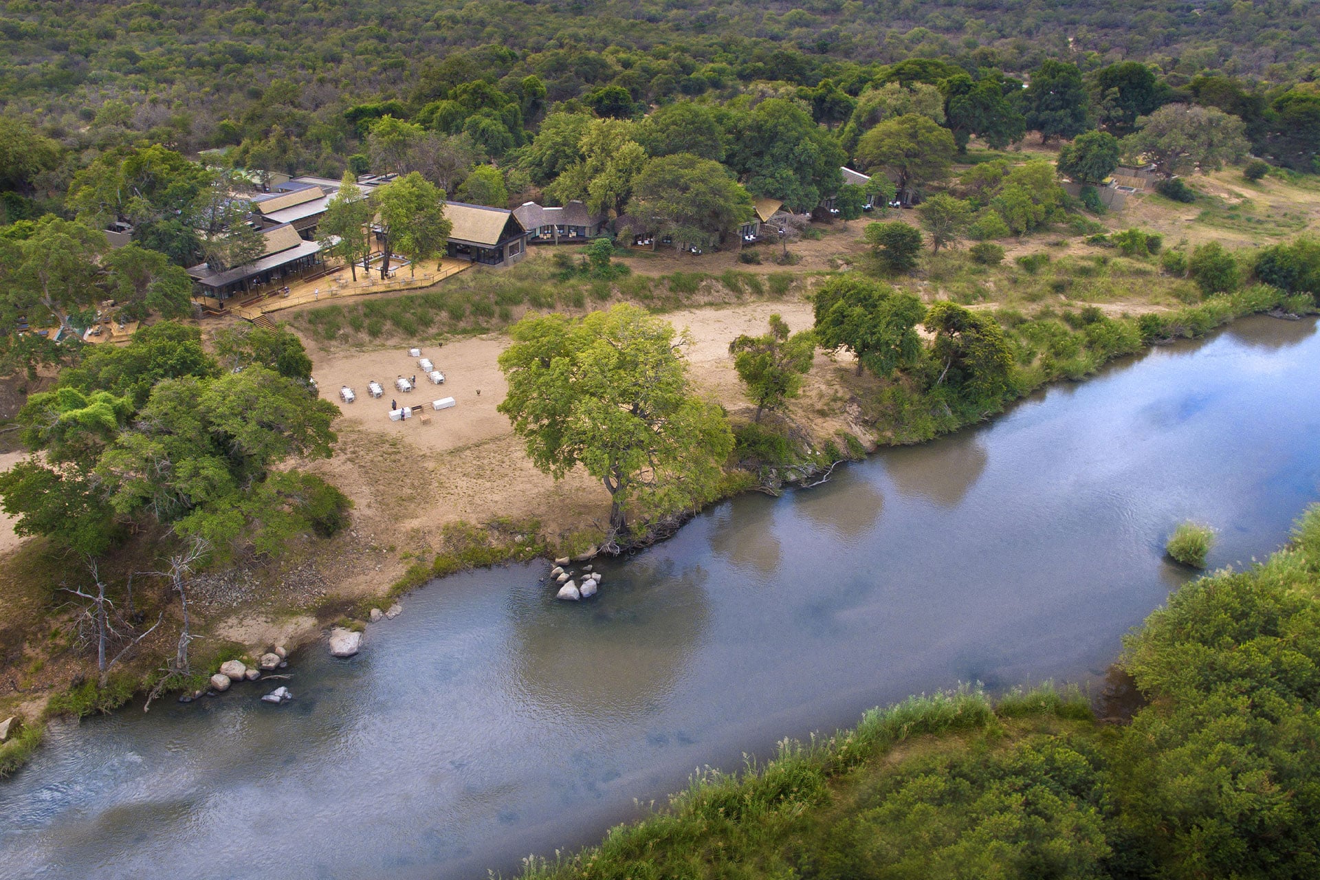 An aerial view of Lion Sands River Lodge and the Sabie River in Sabi Sands Game Reserve. 