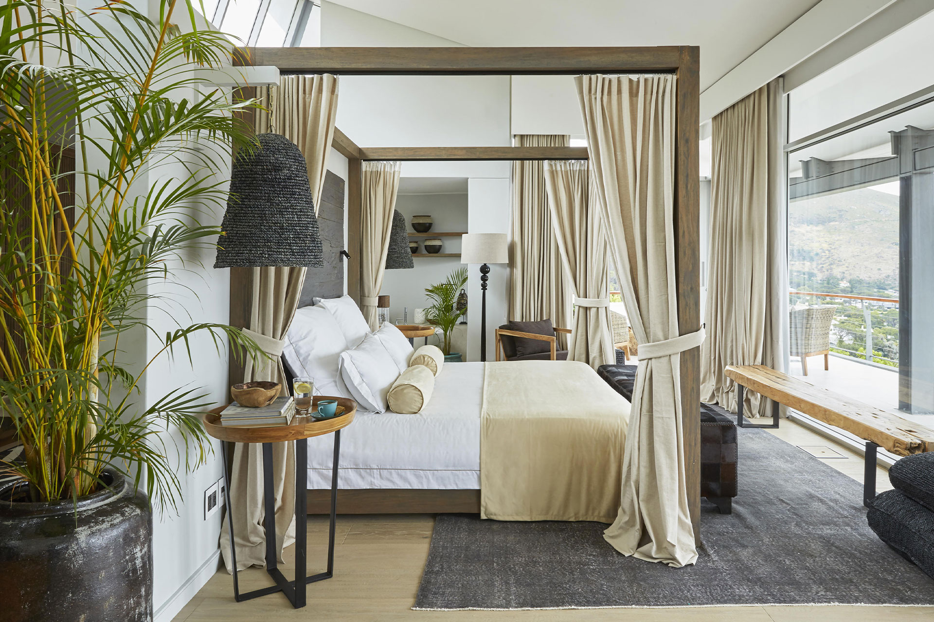 A luxurious bedroom suite with a view at The Residence by Atzaró in Cape Town, South Africa. 