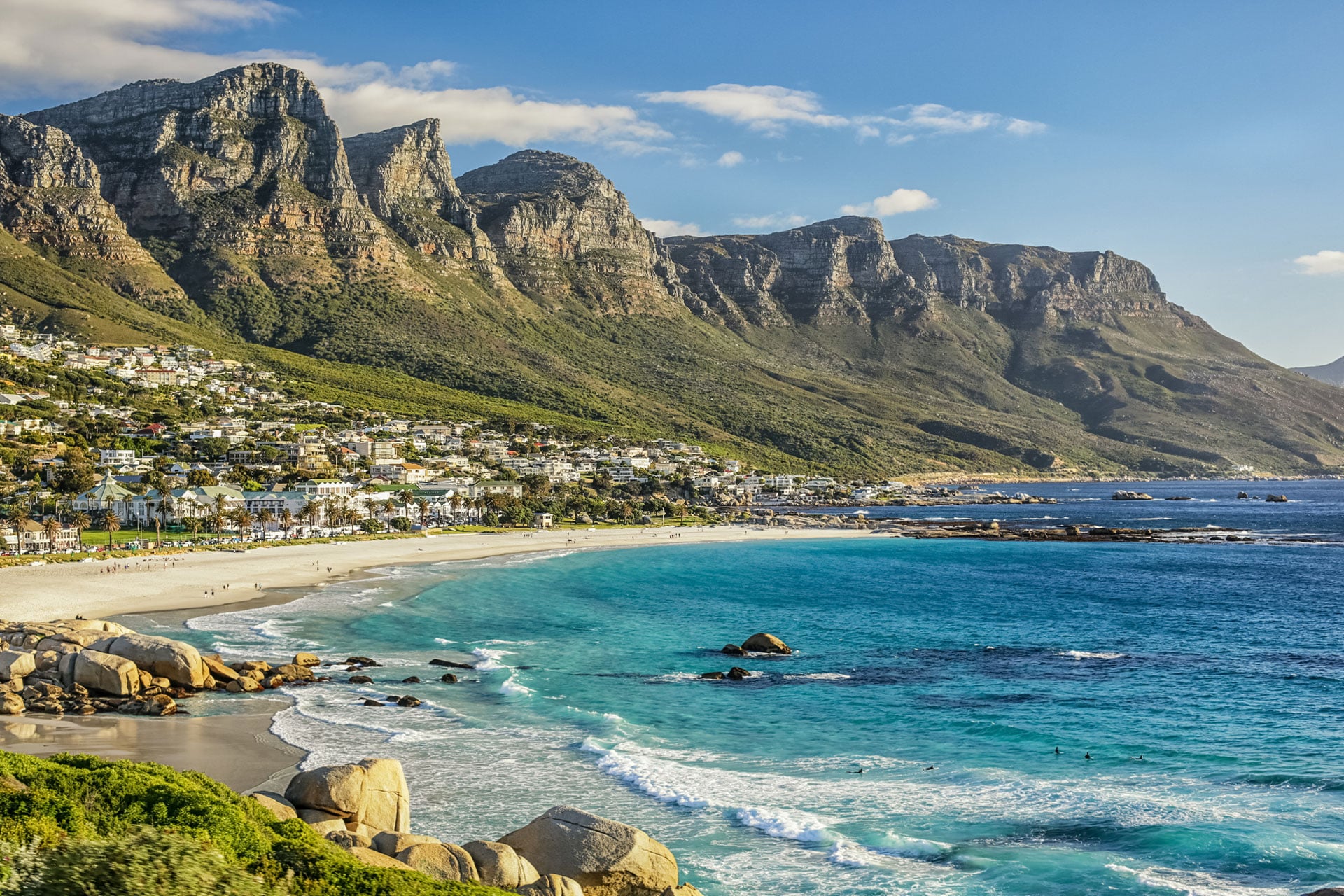 Cape Town&rsquo;s Camps Bay beach with the Twelve Apostles of Table Mountain in the background.