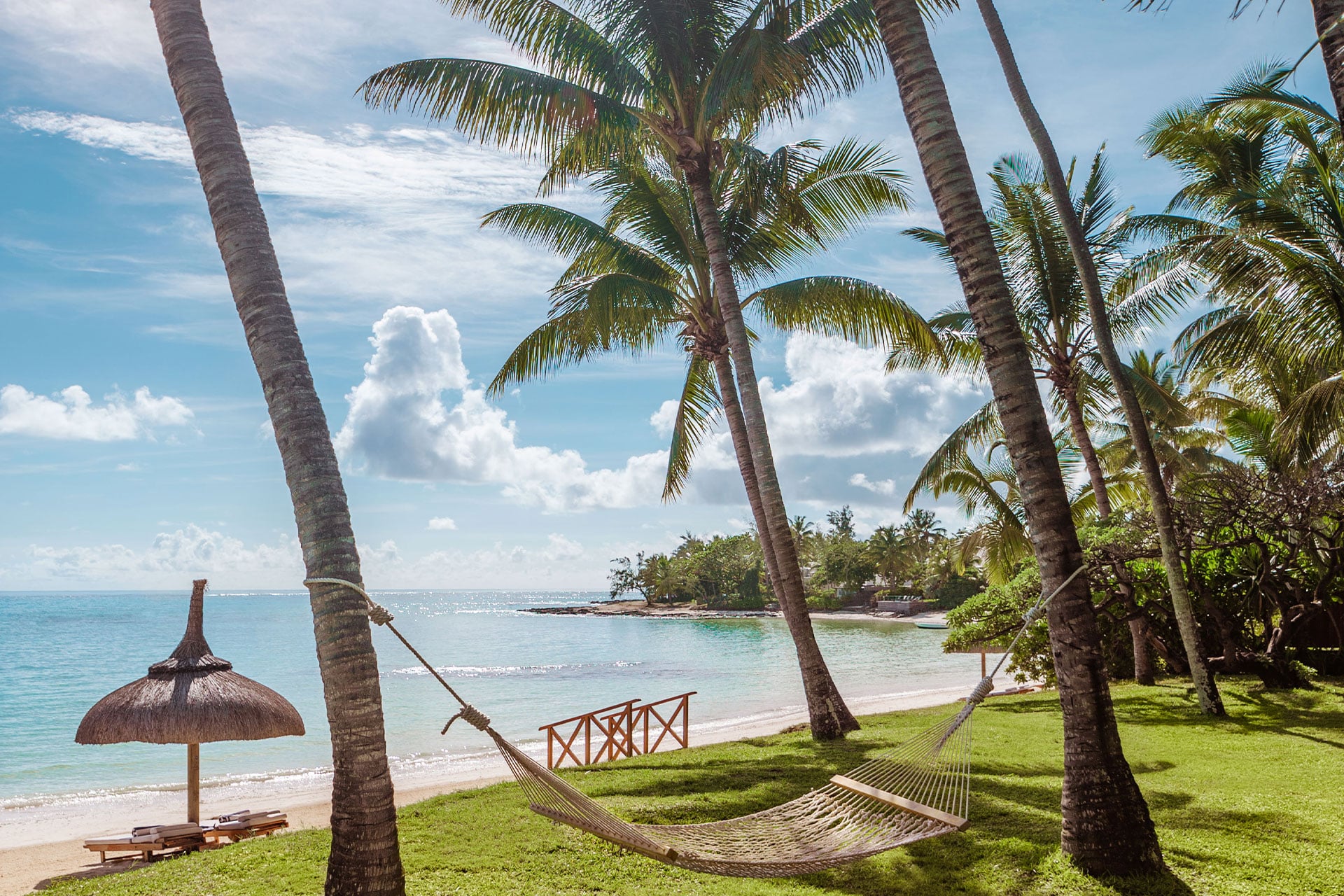 A hammock between two palm trees at the One&Only Le Saint G&eacute;ran in Mauritius.