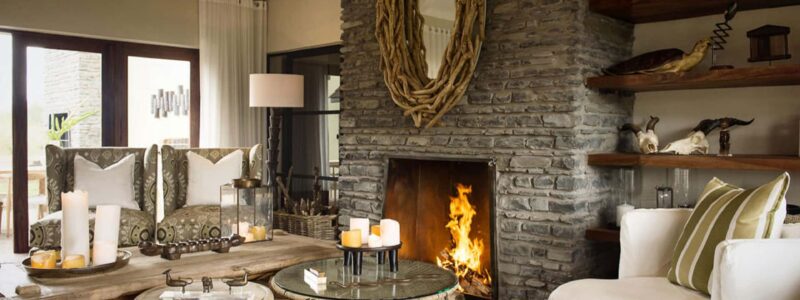 Siringit Villa luxury Living Room, fireplace, African, decorations, design. See more with us.