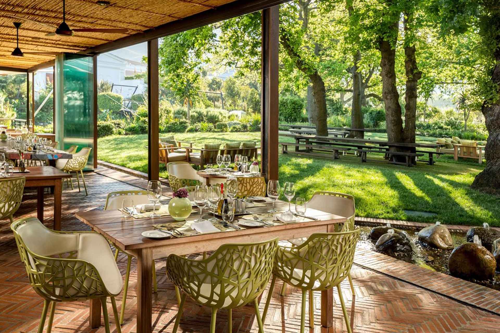 The terrace and gardens at Pierneef &agrave; La Motte restaurant &ndash; one of the top Cape Winelands restaurants. 