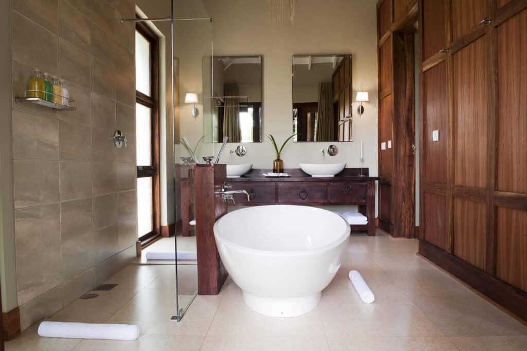 Bathroom at Lake Duluti Lodge with a freestanding bathtub - Arusha Hotel Tanzania