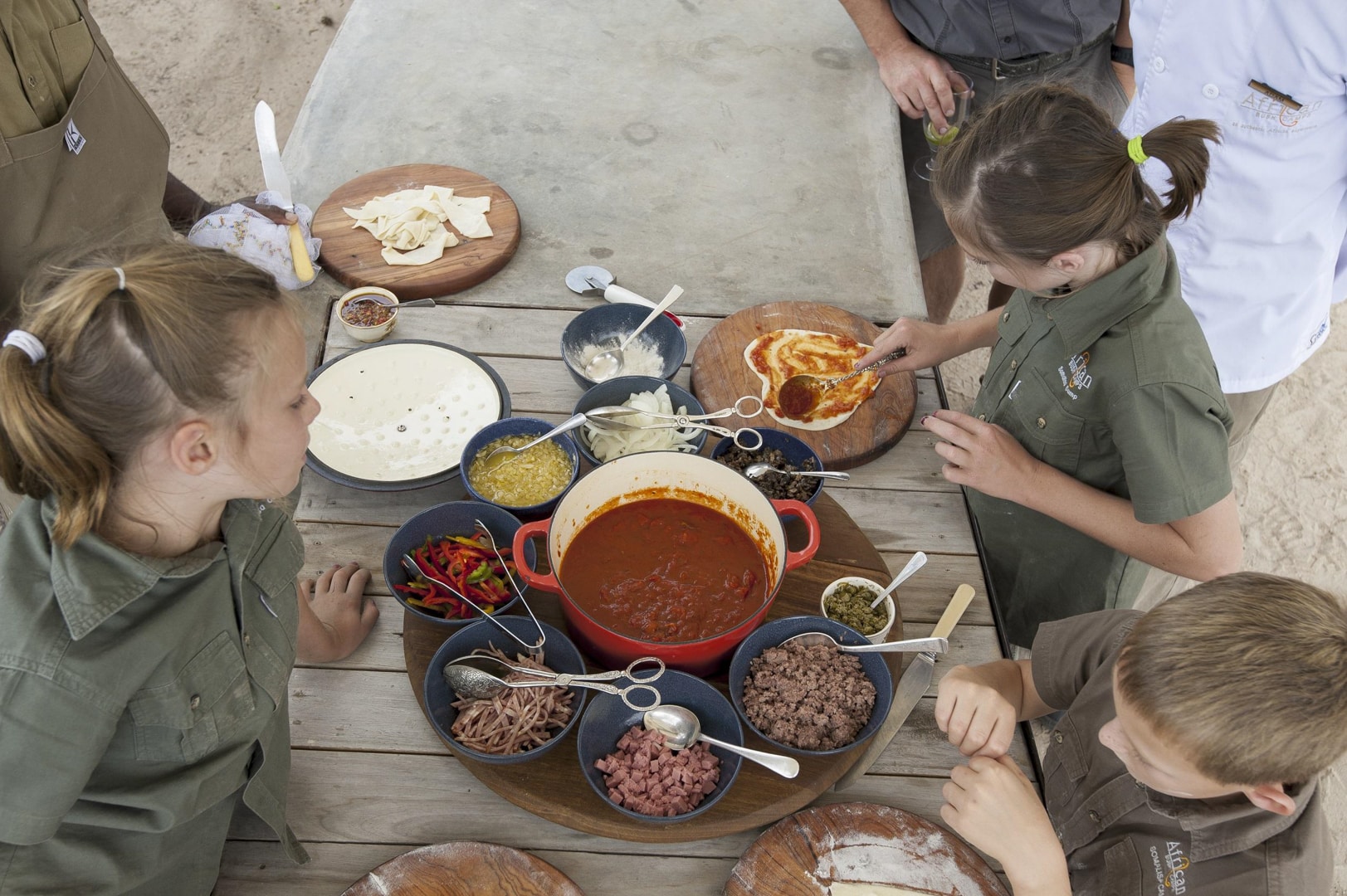 Kids designing their own pizzas at Somalisa Acacia &ndash; one of Southern Africa&rsquo;s best family friendly lodges.