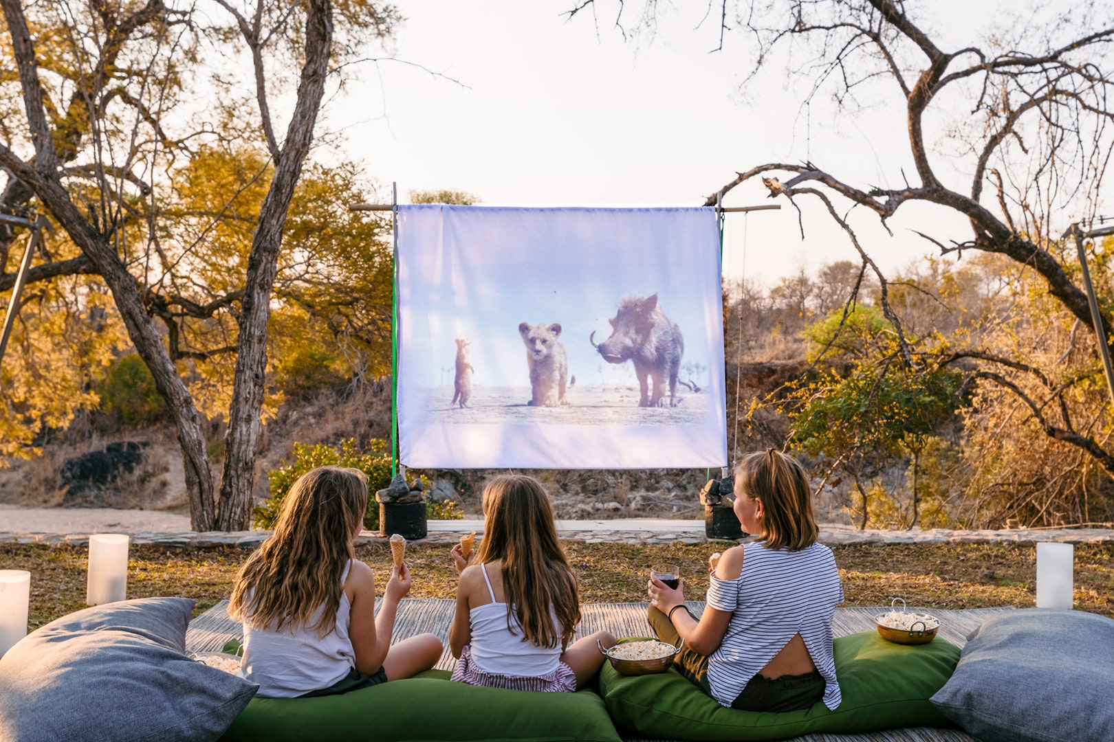 Kids watching a movie on a projector at Thornybush Game Lodge &ndash; one of Southern Africa&rsquo;s best family friendly lodges. 
