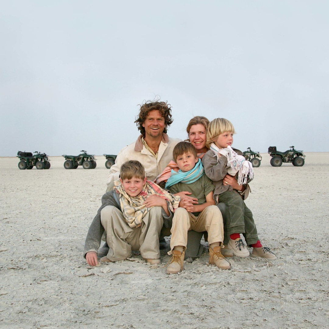 A family portrait with quad bikes in the background at Camp Kalahari &ndash; one of Southern Africa&rsquo;s best family friendly lodges. 