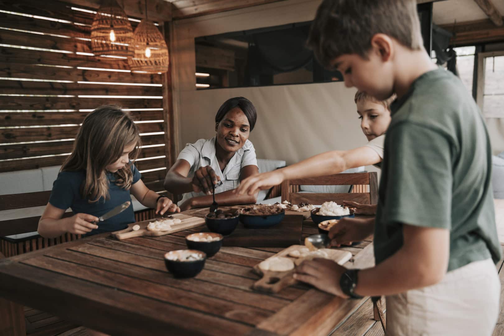 Kids making food with their Bush Buddy at Little Vurumba &ndash; one of Southern Africa&rsquo;s best family friendly lodges. 