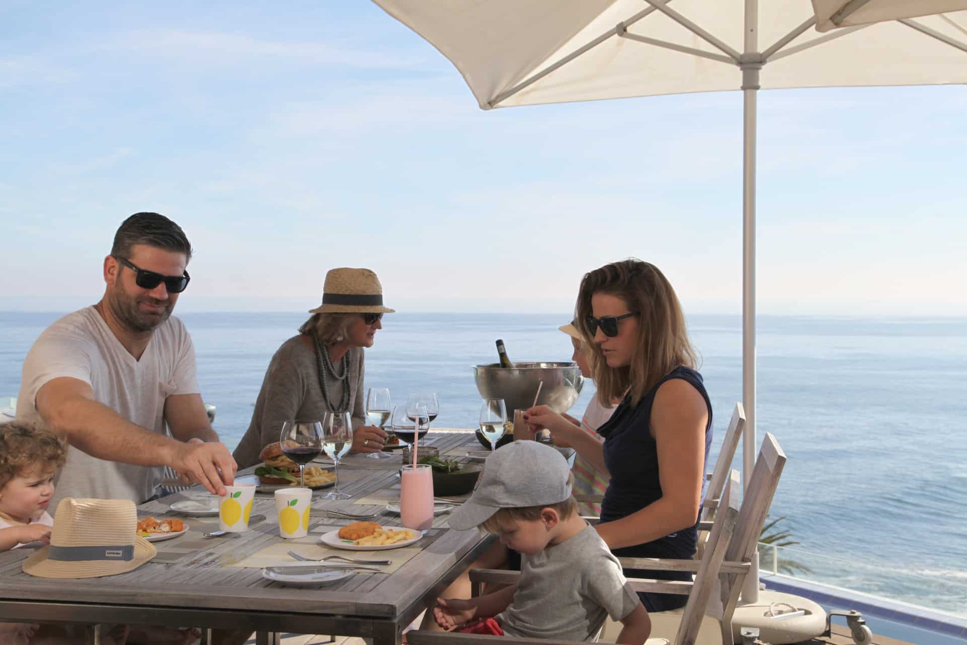 Family dining at one of the Ellerman House&rsquo;s villas - an indulgent experience during Christmas in South Africa.