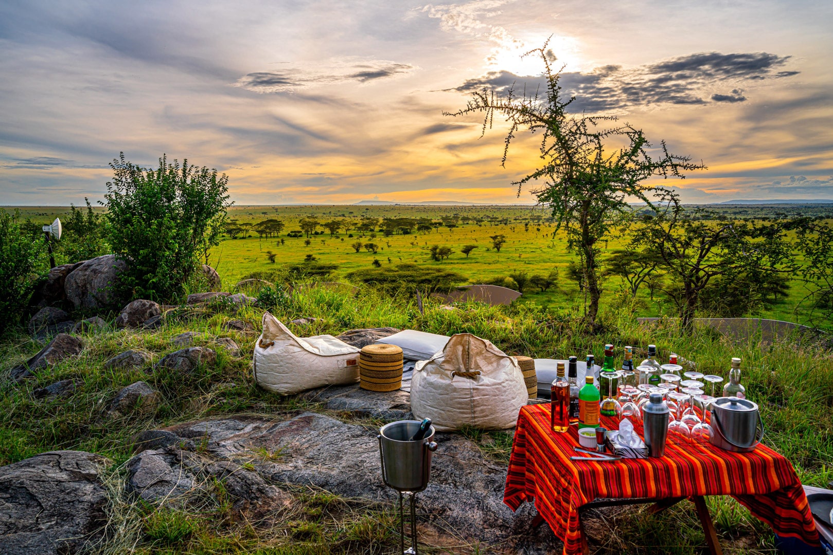 Sundowners set up on the hillside at Lemala Kuria Hills