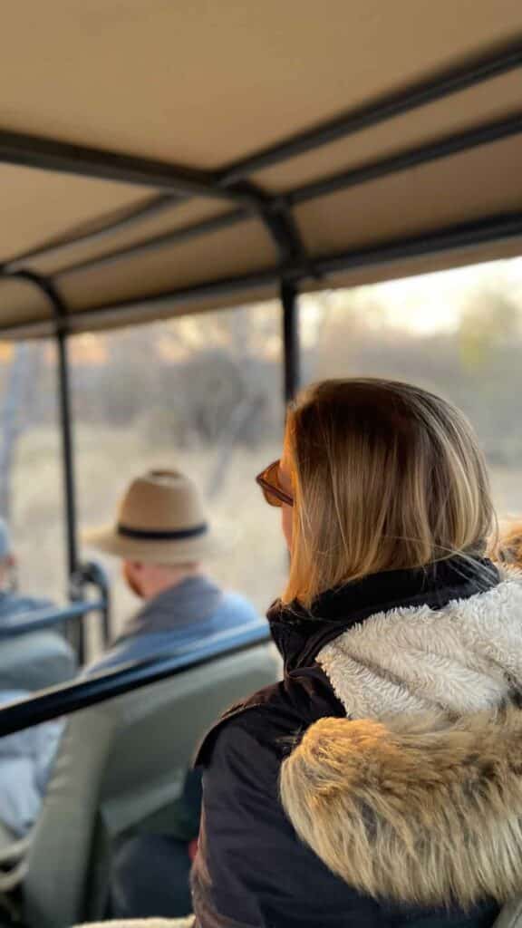 The back of a girl's head on a safari vehicle at Jabulani Safari lodge. 