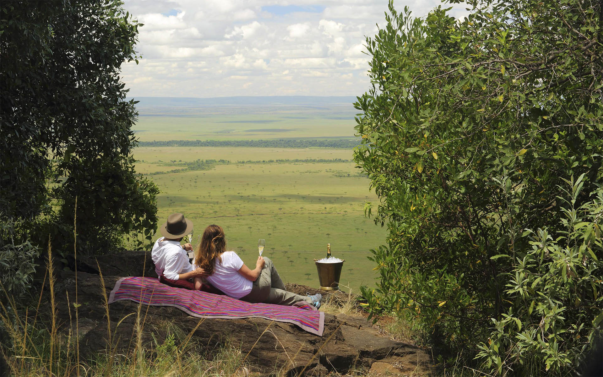 A romantic picnic on the crest of the &lsquo;Out of Africa&rsquo; kopje at Angama Mara, part of Ker & Downey Africa&rsquo;s best Africa safaris of 2022. 