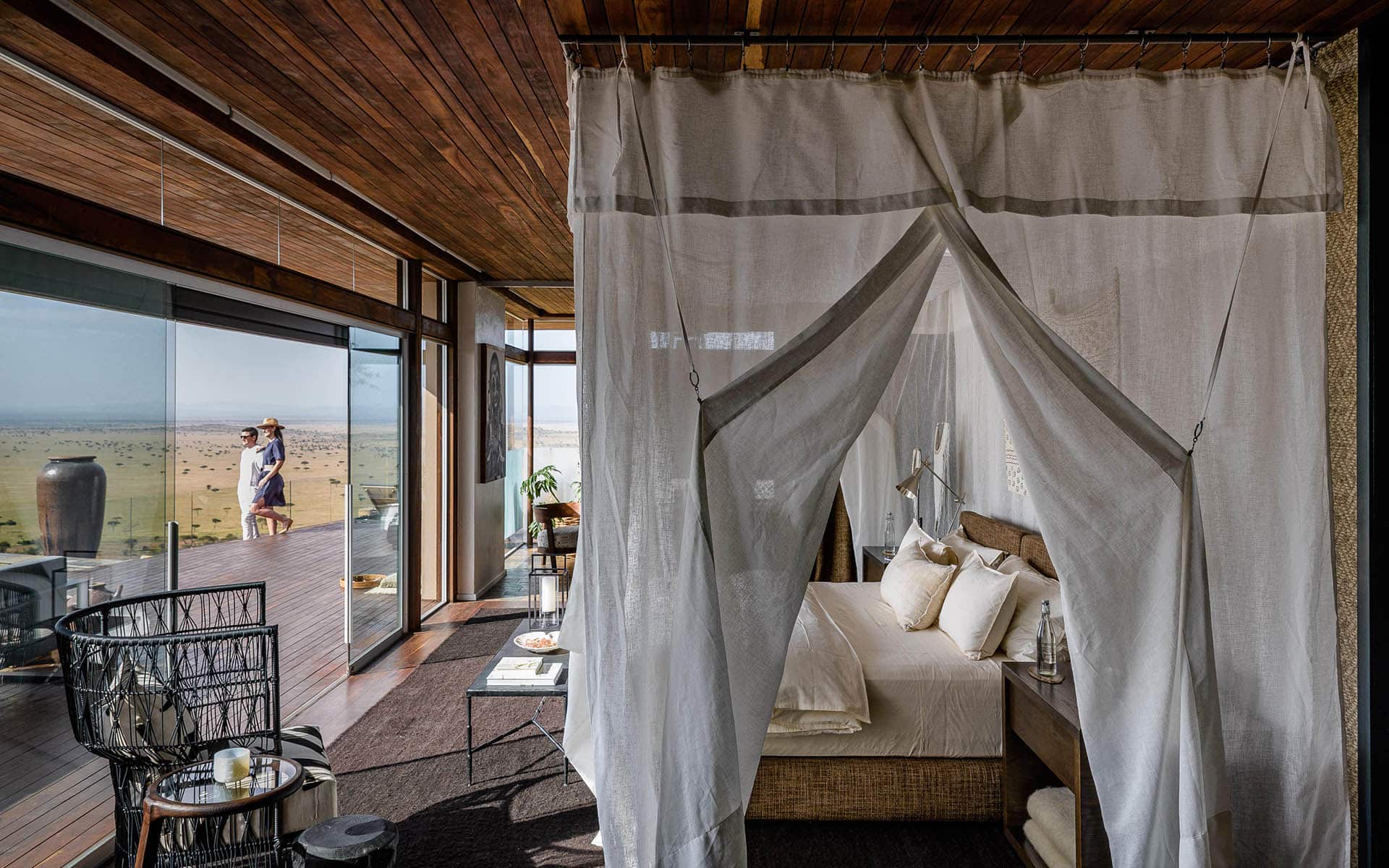 A luxury bedroom at Singita Sasakwa &ndash; a top choice for the responsible traveler.