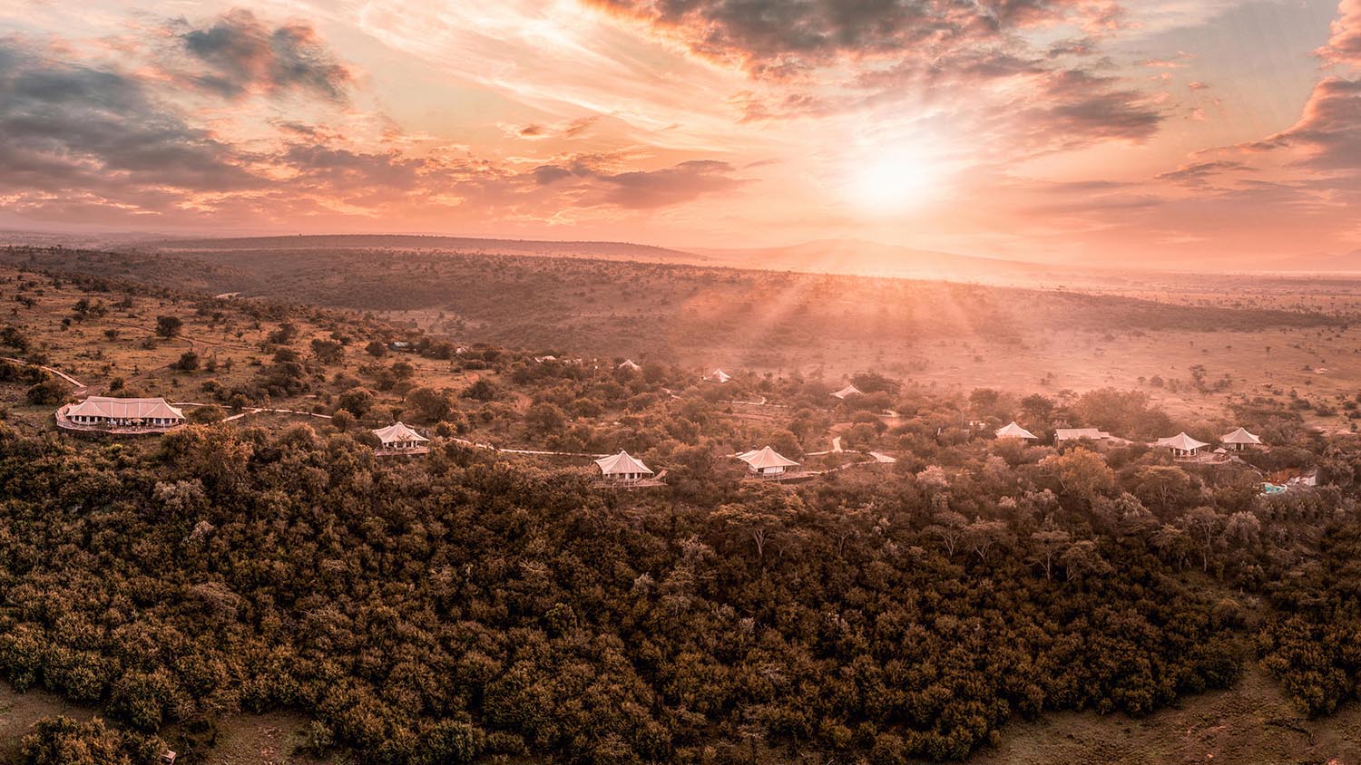 Sunrise over bush at Ol Seki Hemingways with Ker & Downey Africa