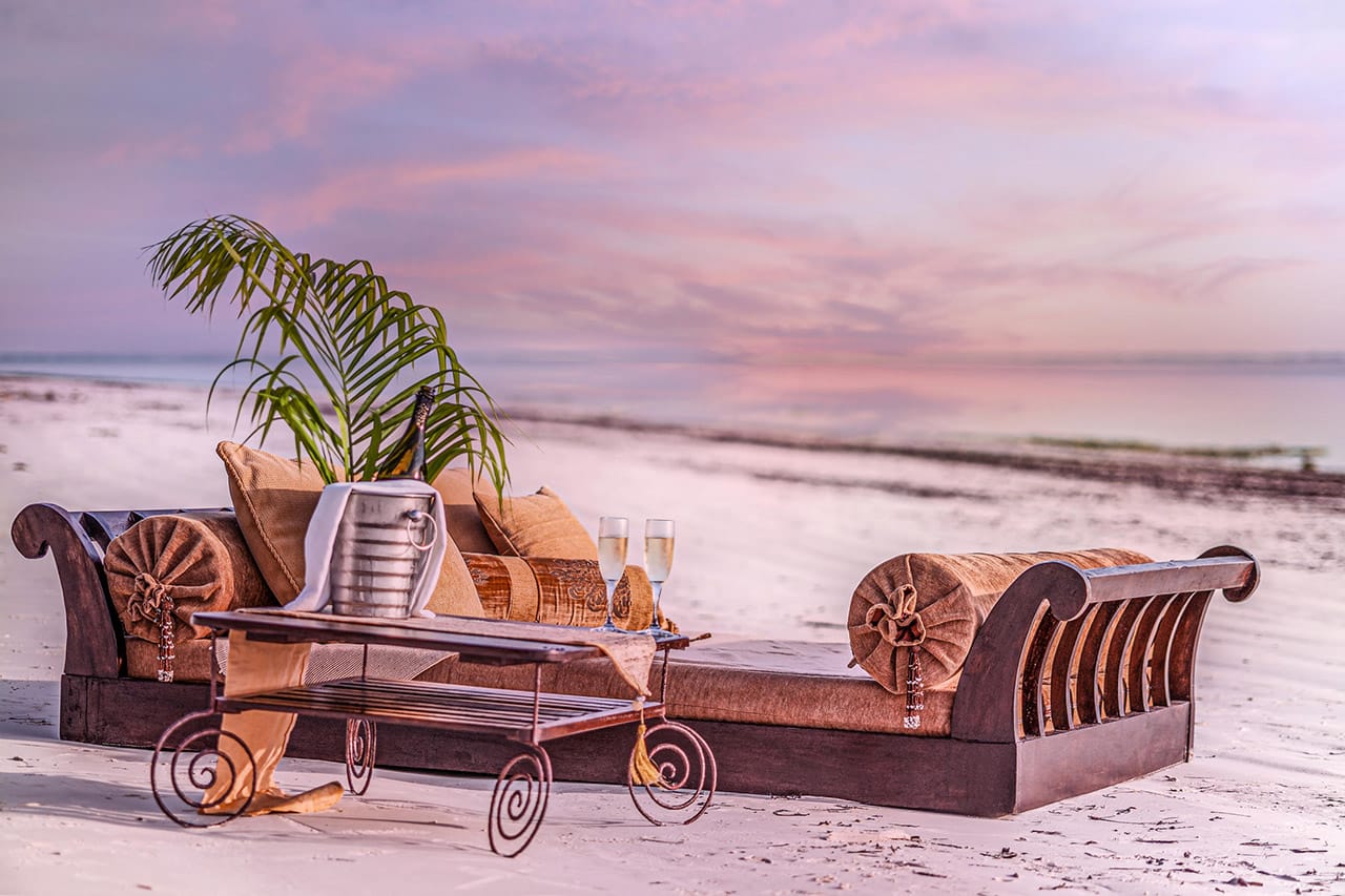 Hands weaving palm fronds with Ker & Downey Africa