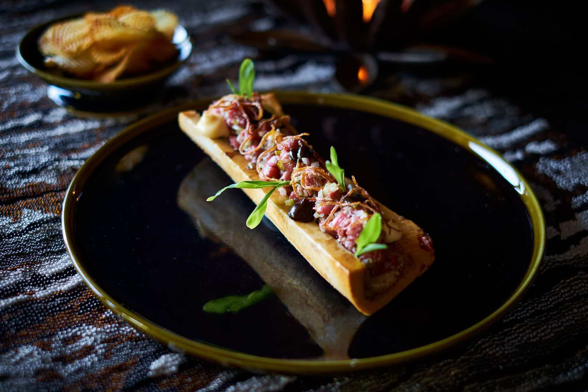 Dining at Xigera luxury lodge with Ker & Downey Africa