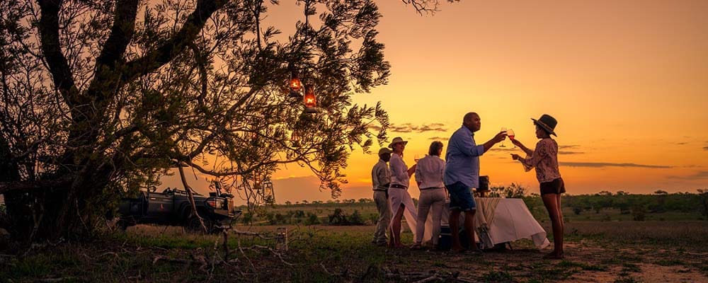Cheetah Plains serving sundowners as the sun sets with Ker & Downey Africa