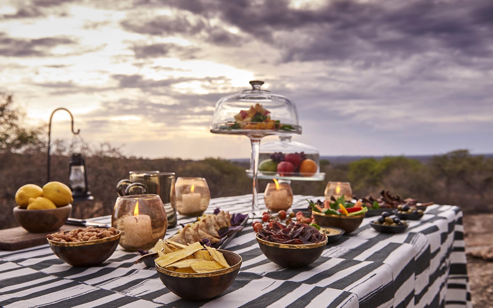 Sundowners served at Mwiba Lodge with delicious eats, with Ker & Downey Africa