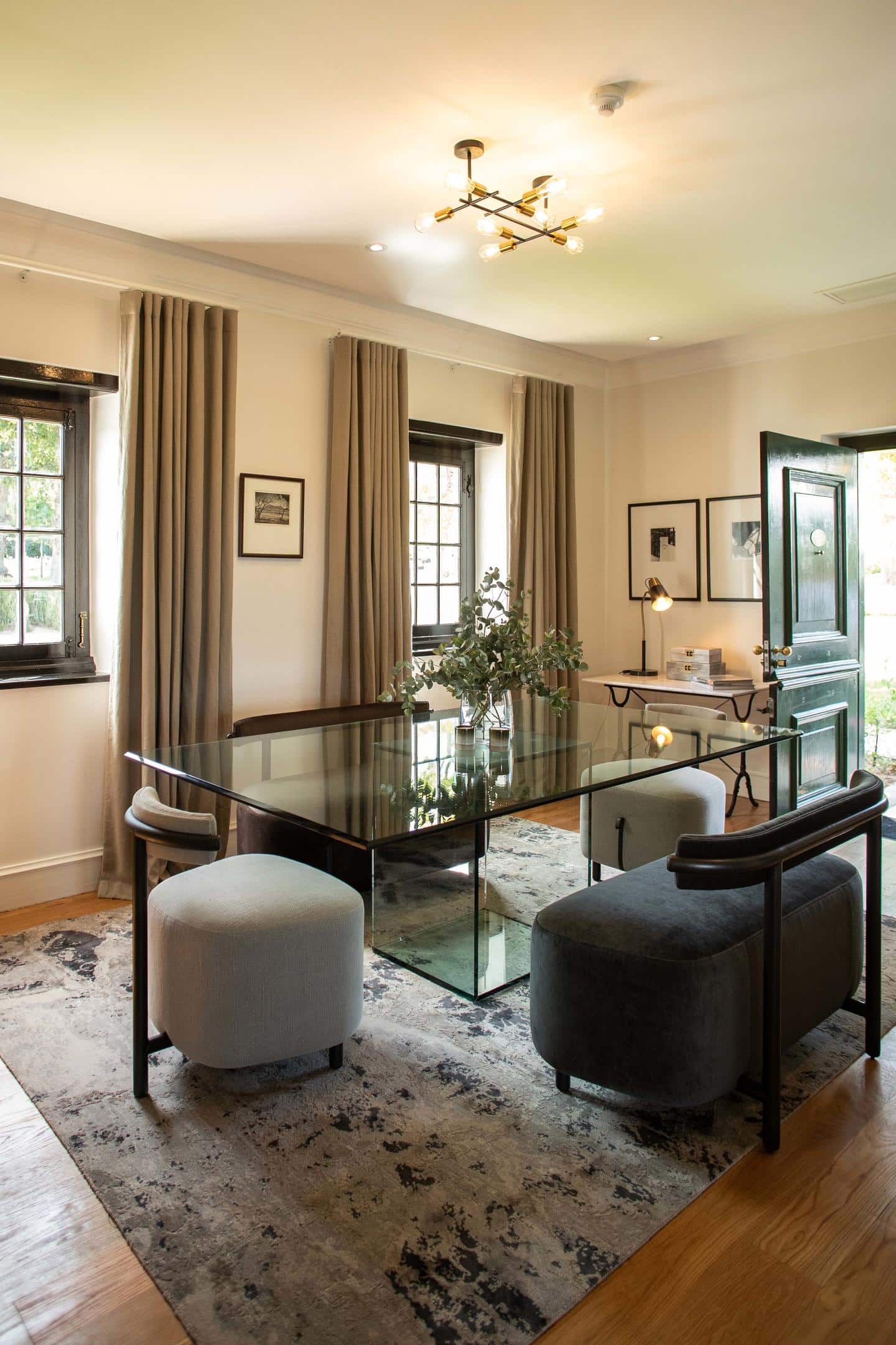glass dining table in the one-bedroom suite at Steenberg Hotel & Spa with Ker & Downey Africa