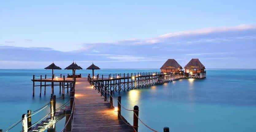 The lights at night on the jetty at Melia Zanzibar with Ker & Downey Africa